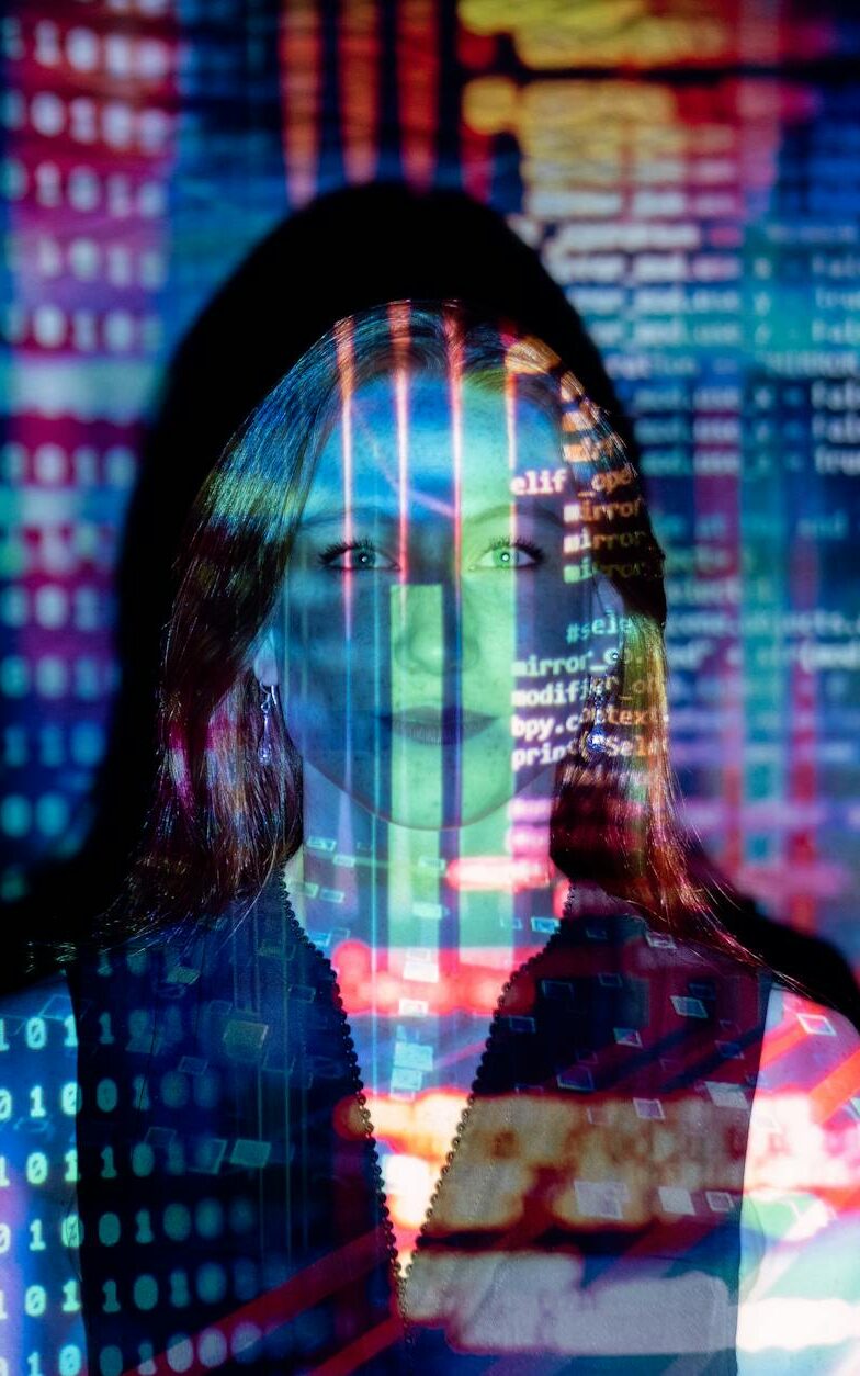 code projected over woman